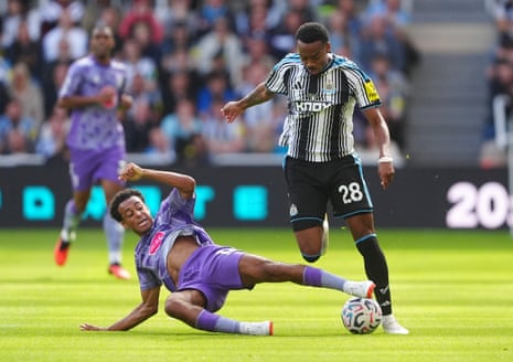 Tyler Adams slides in to tackle Joe Willock.