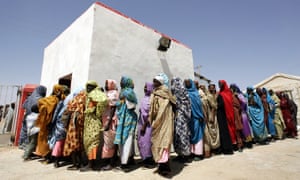 Displaced Sudanese women wait in line for a medical checkup in the Darfur city of Nyala.