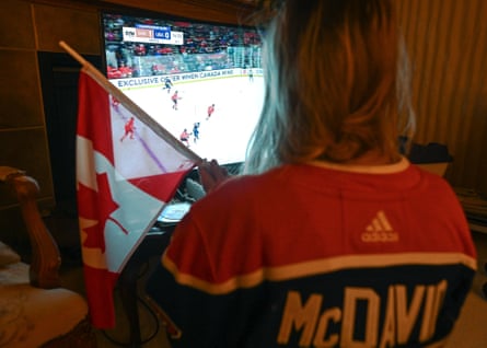 An Edmonton Oilers fan in Edmonton, Alberta, watches Canada face the United States in the final of the 4 Nations Face-Off on Thursday night.
