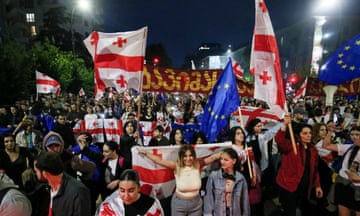 Demonstrators with Georgian national and EU flags rally against the foreign agents bill in Tbilisi on Monday.