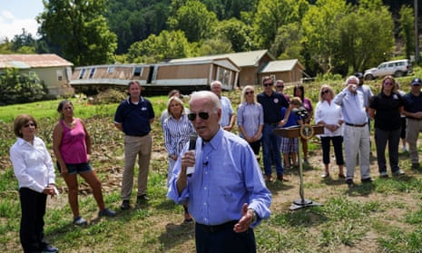 Joe Biden is accompanied by first lady Jill Biden, state and local officials, as he delivers remarks after meeting with families affected by the recent flooding in Kentucky in Lost Creek on Monday.