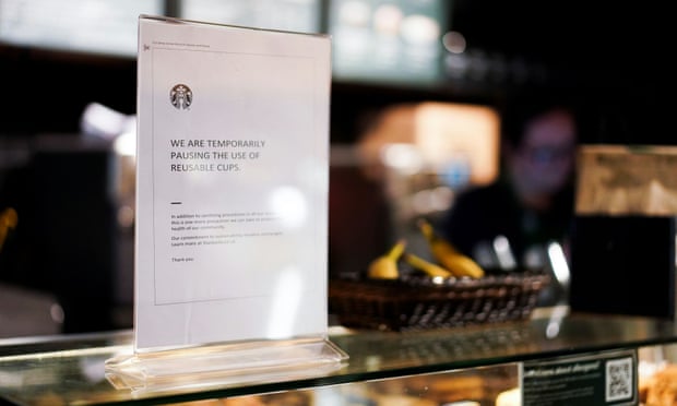 A sign explaining that drinks will not be served in reusable cups in a Starbucks in London
