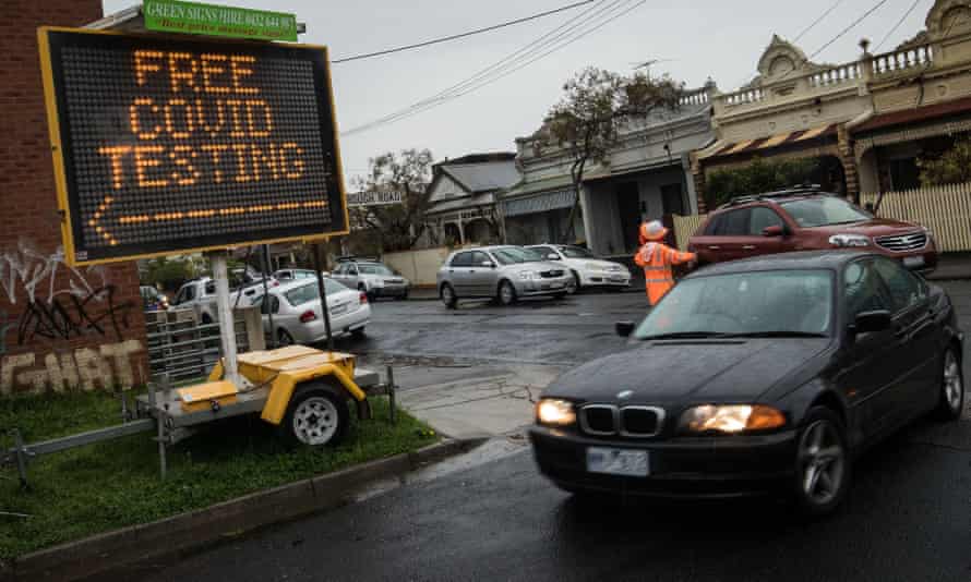 Cars enter a drive-through Covid testing site in Brunswick in Melbourne’s north.