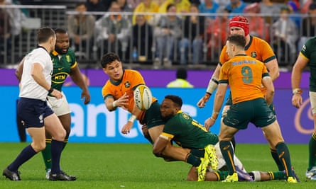 Noah Lolesio offloads the ball as the Wallabies challenged the Springboks early in the Test at Optus Stadium
