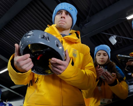 Ukraine skeleton racer Vladyslav Heraskevych holds his memorial helmet