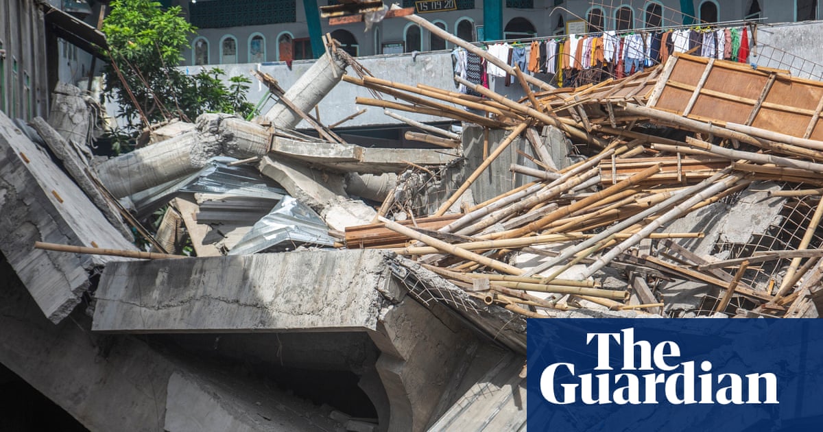Indonesia school collapse: one dead, 65 buried under rubble as rescuers race to find survivors