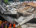 Indonesia school collapse: three dead and over 90 missing as rescue effort continues