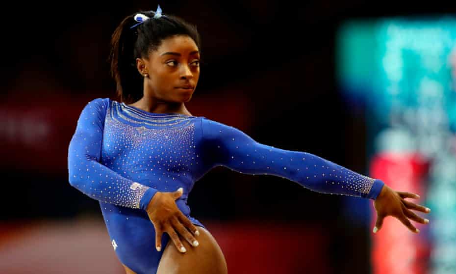 Simone Biles posted the top all-around score at the world gymnastics championships despite a hospital visit on the eve of the event.