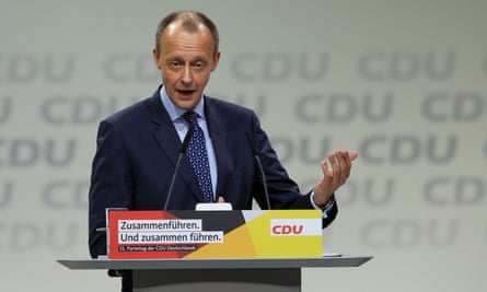 Friedrich Merz, one of the three candidates for the leadership of the CDU, delivers a speech to delegates at the party’s annual conference on Friday