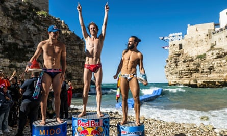 From left: Aidan Heslop, Gary Hunt and Cătălin-Petru Preda celebrate on the podium at the Red Bull cliff diving world series at Polignano a Mare, Italy, on 18 September 2022.