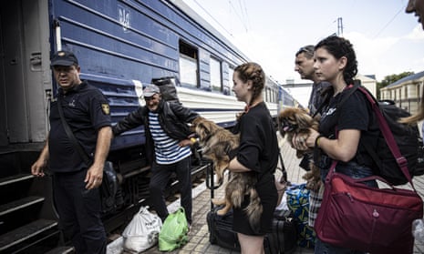 Civilians evacuated from the Donetsk region arrive at Pokrovsk train station to be sent to safe zones in Ukraine