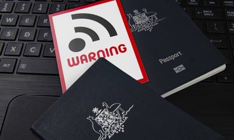 Australian passports on a computer with internet warning card