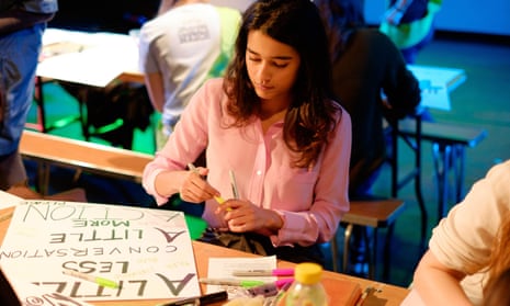 Banners and placards are prepared in advance of The People’s London Climate March, at ‘Get Crafty for our Climate’ at in Shoreditch, London
