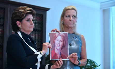 Robin and her attorney Gloria Allred hold up a photo of Robin when she was 16, at the time of the alleged assault.