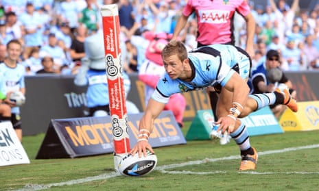 Nathan Stapleton scores for Cronulla against the Warriors in 2014. The winger played 61 games for the Sharks.