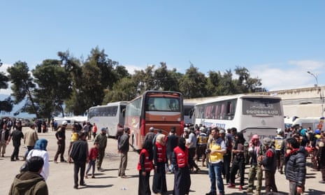 A convoy of vehicles carrying civilians from eastern Ghouta