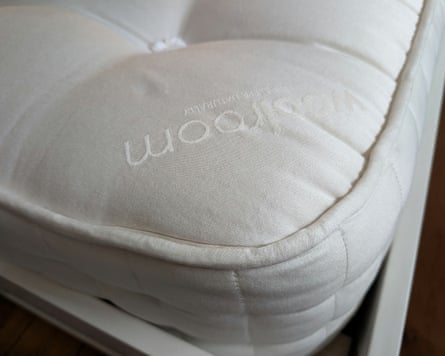 A Woolroom Standen Wool is a white bed frame