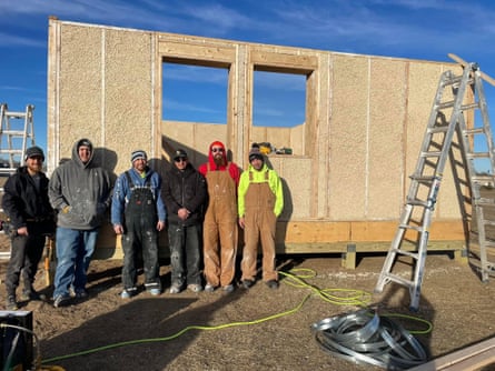 Danny Desjarlais (far right) and his crew standing in front of the first prefabricated hempcrete panel house in Minnesota, installed in December 2023. The walls of this 520-sq-ft house were installed in less than six hours.
