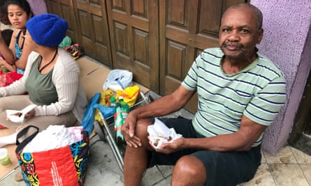 Valdir de Souza, 72, retired, was first in line when the Happy Little Angel project in Rio opened for its weekly food handouts.