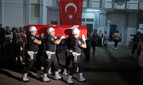 Turkish police carry of the coffin of Aysenur Ezgi Eygi as her body is brought to Didim state hospital’s morgue in Didim, Turkey, on Friday