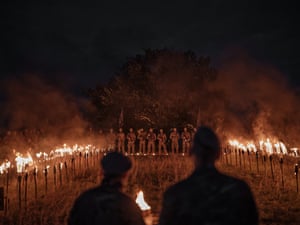 A torchlit ceremony is held for new recruits into Ukraine’s elite 144th special operations centre