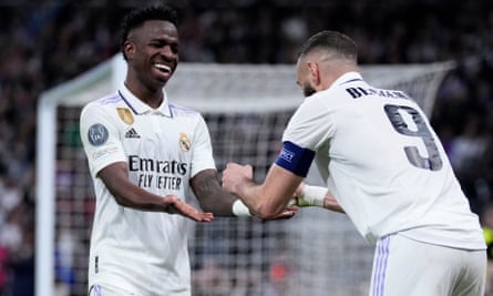 Karim Benzema celebrates with Vinicius Junior after scoring the only goal of the game.