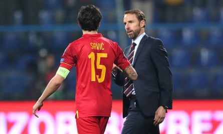 Gareth Southgate speaks to Montenegro captain Stefan Savic on the final whistle.