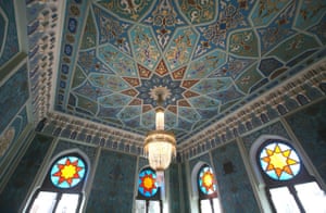 Ceiling and stained glass detailing inside.