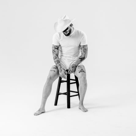 Man wearing cowboy hat in black and white photo