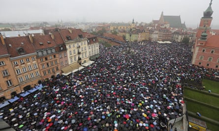 Thousands hold umbrellas in Warsaw during a nationwide strike to protest a near total ban on abortion.