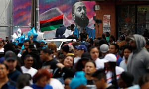 Fans wait for the funeral procession following a memorial for Nipsey Hussle along Slauson Avenue in Los Angeles on 11 April.