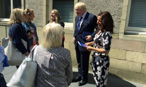 Boris Johnson speaks to family members after attending his daughter Lara’s graduation in St. Andrews, Scotland.