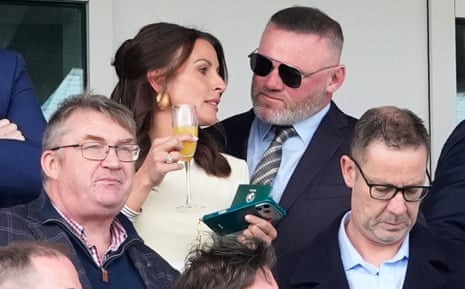 Coleen Rooney and husband Wayne at Aintree.