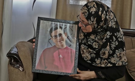 Salaam Zahran holds a picture of her son