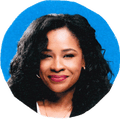 woman smiling against blue background