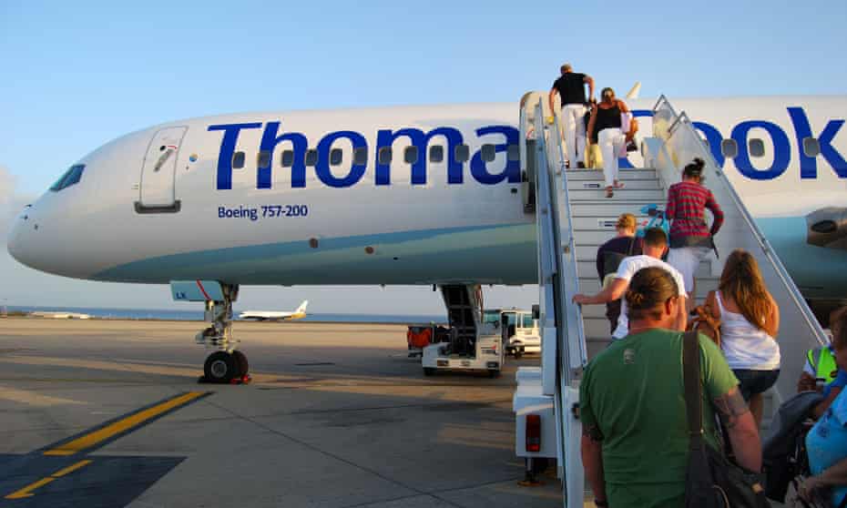 Passengers board a Thomas Cook flight
