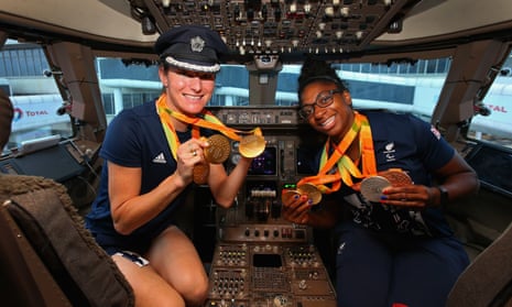 Sarah Storey and Kadeena Cox of the ParalympicsGB team show their medals before the flight home from Rio.