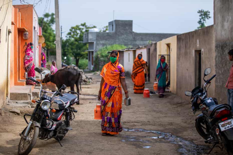 Dairy farmers arrive to deposit milk at Lakshmi Dairy in Karajgaon, in Latur District, Maharshtra, October 2020