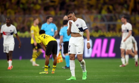 Kylian Mbappe of Paris Saint-Germain reacts at full-time following his team's defeat to Borussia Dortmund in their Champions League semi-final first leg.