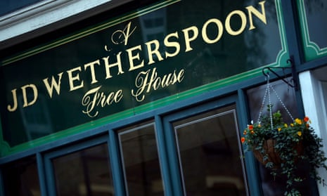 A Wetherspoon's logo is seen on a pub in central London in 2019