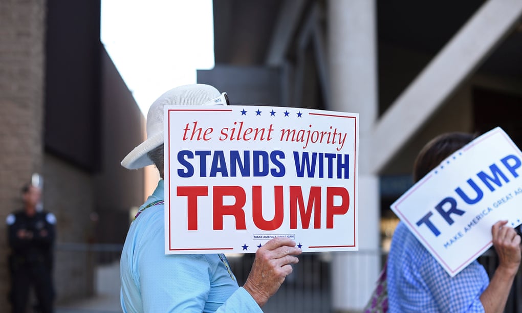 women enter trump rally with 'silent majority signs'