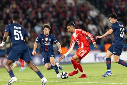 Michael Olise takes on the PSG defence