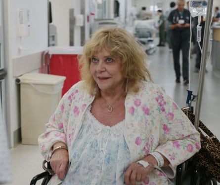 A woman with blond hair in a wheelchair