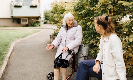 elderly woman outside with a nurse