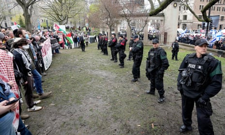 Police separate pro-Palestinian and pro-Israel demonstrators on the outskirts of a protest encampment on the grounds of McGill University, in Montreal, Canada. 