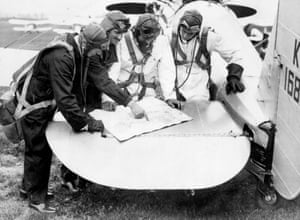 1935: Pilots of 111 Squadron use the tail plane of a Bristol Bulldog fighter to plot their route on a map