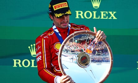 Carlos Sainz of Ferrari celebrates on the podium after the Australian F1 Grand Prix at Albert Park Circuit in Melbourne