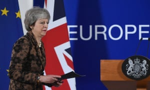 Britain’s PM Theresa May arrives for a press conference in Brussels.