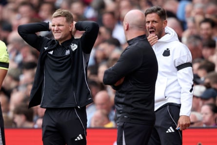 Eddie Howe grimaces pinch his hands down his head