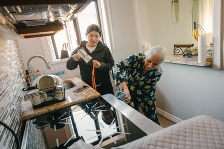 an elderly resident cleans her new induction stove